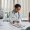 Man in White Dress Shirt Sitting at the Table